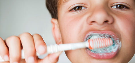 Child brushing teeth